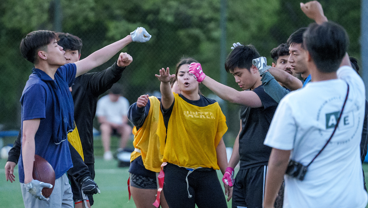 Group of students playing sports outdoors