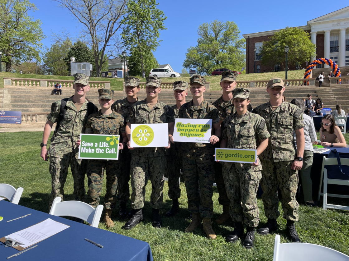 ROTC Students Holding Gordie Center Signs